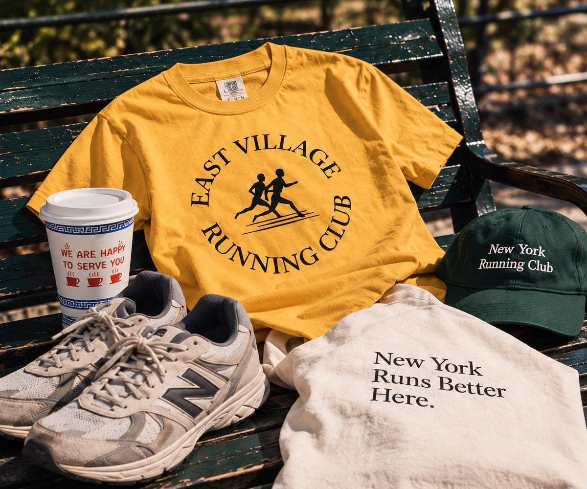 East Village Running Club mustard tee running flat lay