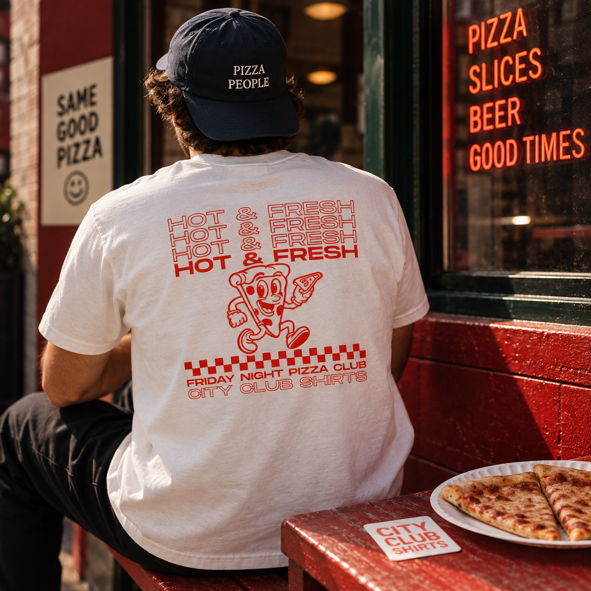 Friday Night Pizza Club tee at a neighborhood pizzeria