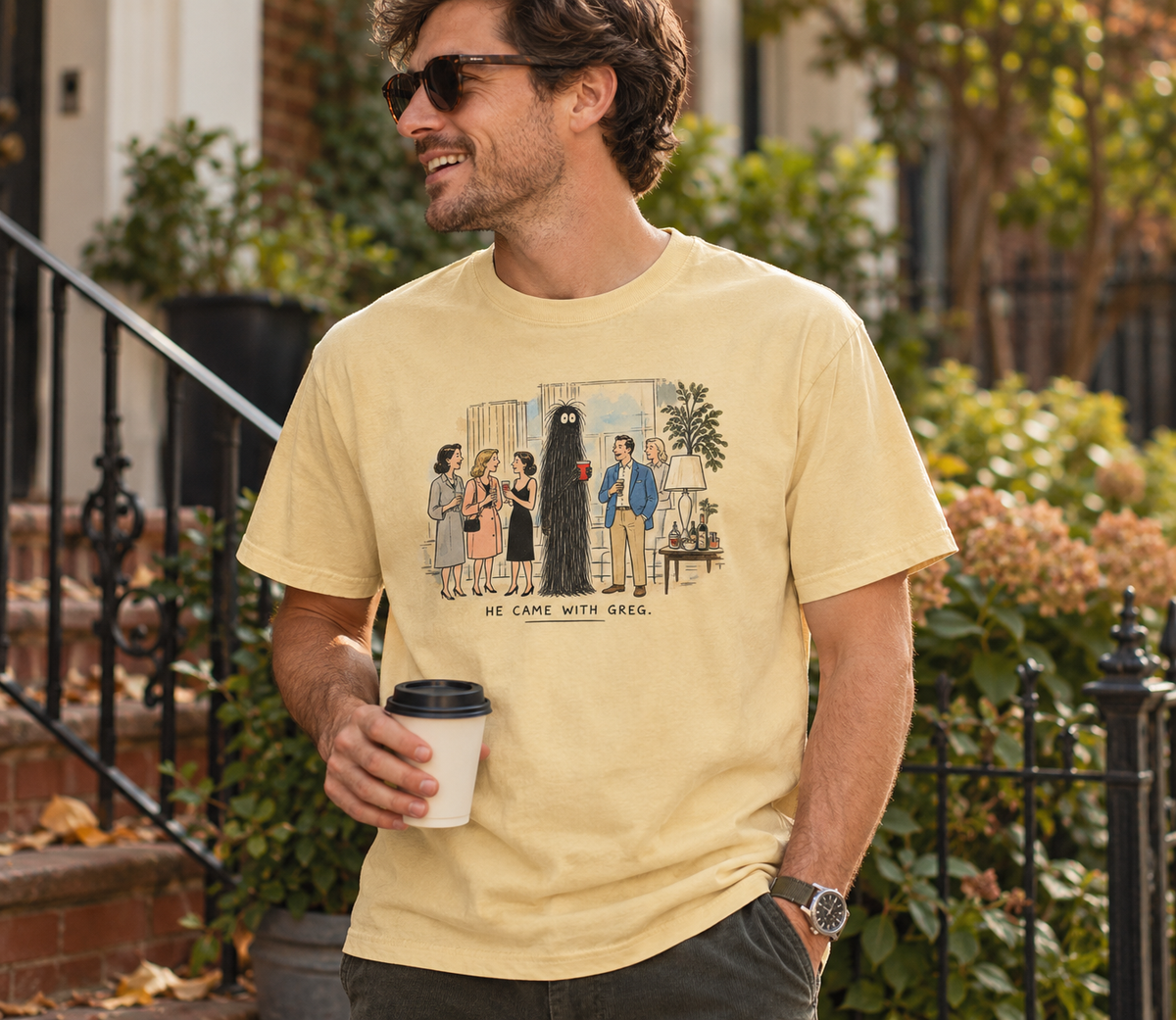 Man wearing He Came With Greg Butter graphic T-shirt