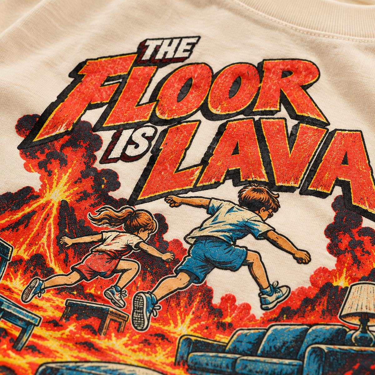 Close-up of The Floor Is Lava graphic on natural youth tee